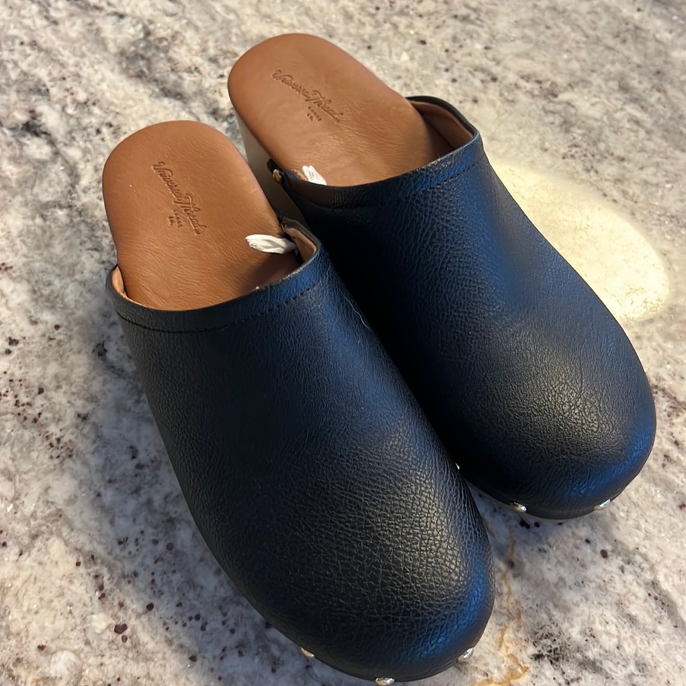 Black clogs with gold studs.  Size 8.  Excellent condition.